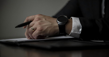 Close up of a hand holding a pen.