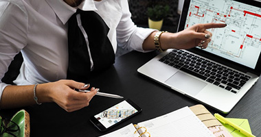 Conveyancer alongside a laptop.