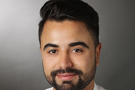 A portrait of Khalid Ramu, Solicitor.